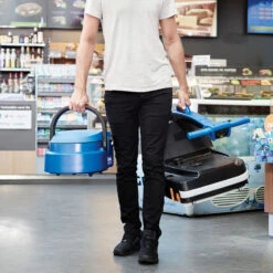 Clarke® MA30™ 13B Micro Floor Scrubber W/ Cylindrical Brush - 1.6 Gallons -Viper Shop clarke ma30 13b micro scrubber being carried