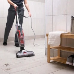 Sanitaire® HydroClean® Hard Floor Washer & Upright Vacuum 8 Sanitaire® HydroClean® Hard Floor Washer & Upright Vacuum -Viper Shop sanitaire hydroclean cleaning a bathroom floor